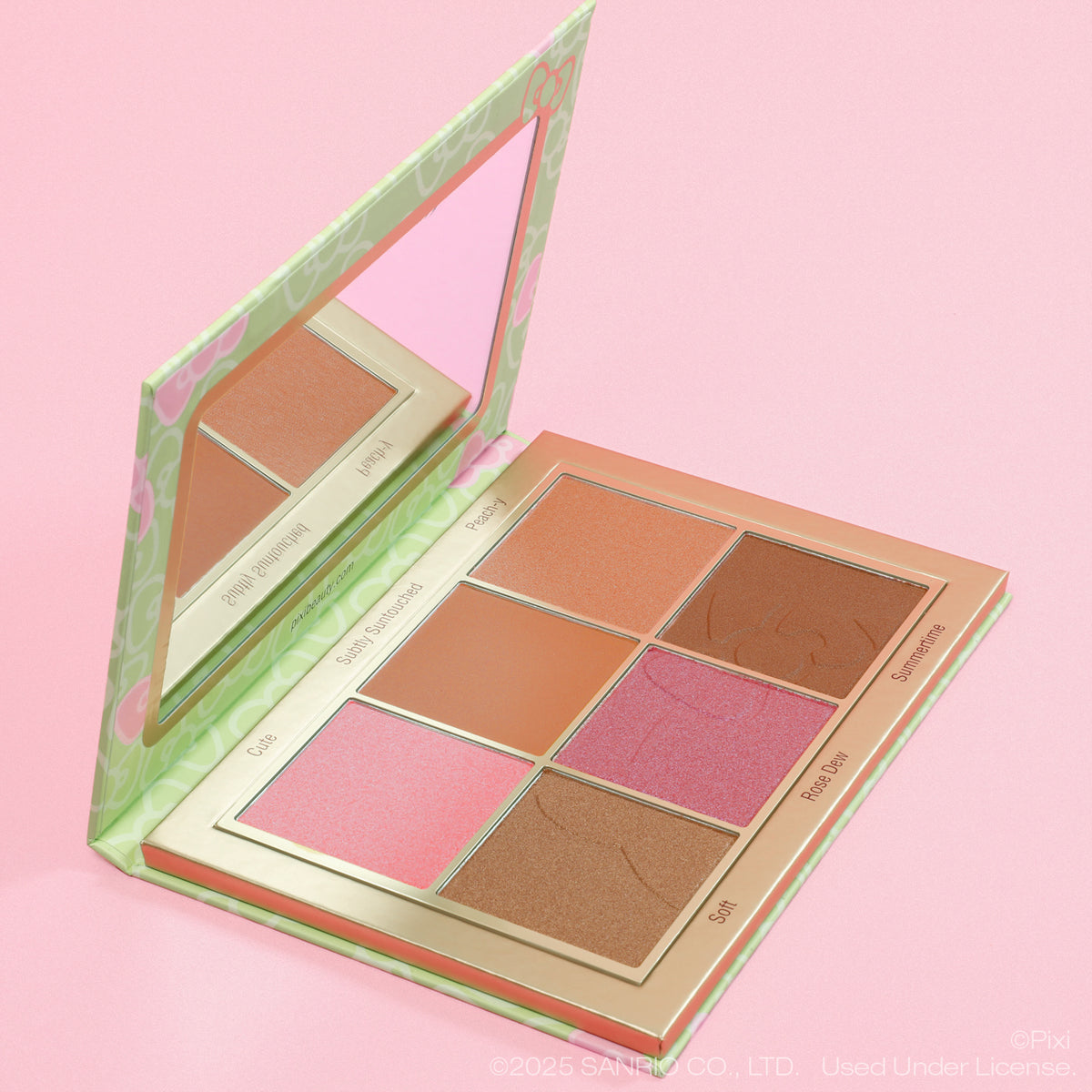 Makeup palette with various shades on a pink background