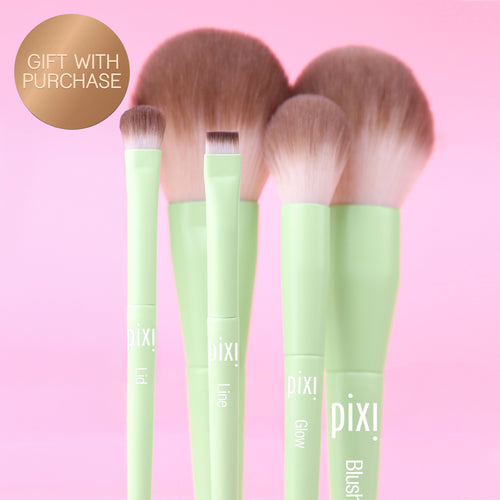 Gift With Purchase: Collection of 5 makeup brushes on a pink background