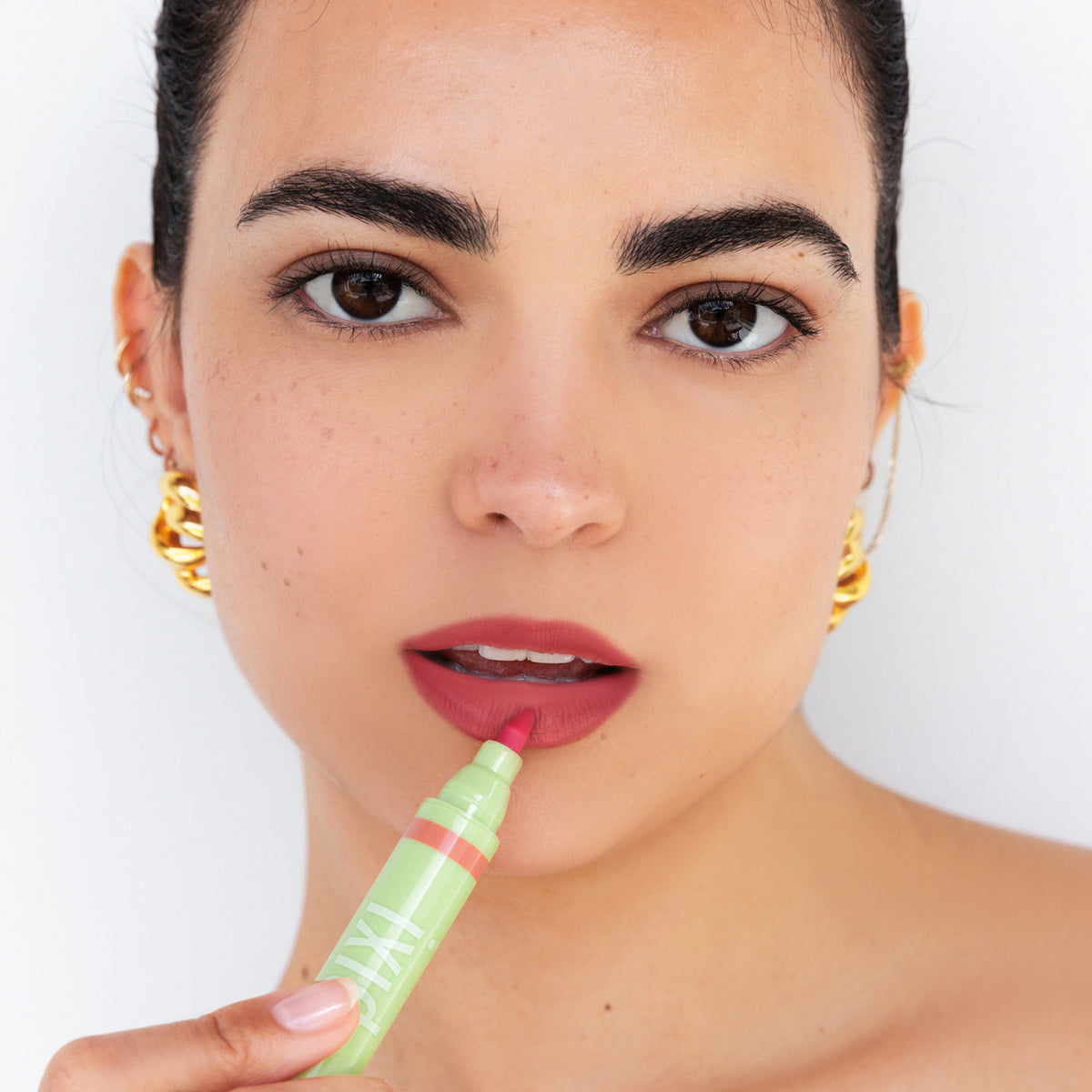 Model wearing LipBlush in shade Purity