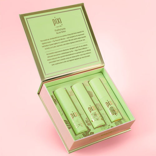 Set of Pixi perfume products in a green box on a pink background view 2