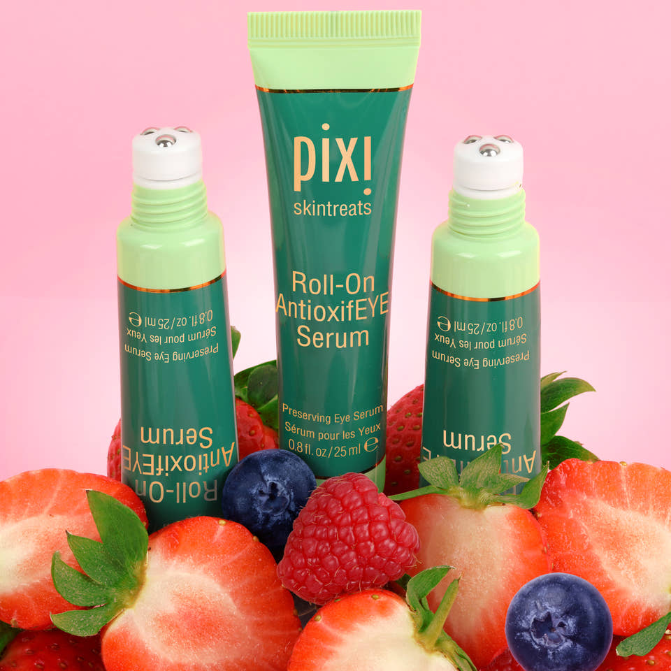 Pixi Roll-On Antioxidant Serum with strawberries and blueberries on a pink background view 2 view 2